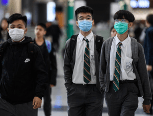 Asian students wearing masks to protect themselves from coronavirus